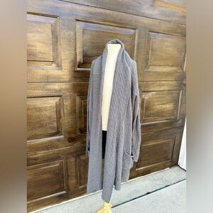 Avenue gray shrug with pockets.